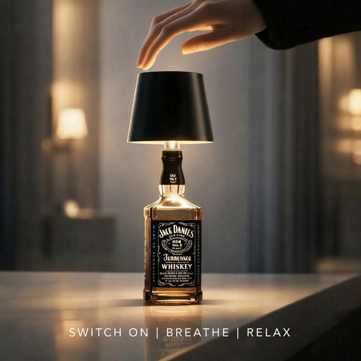 Hand reaching down to touch the top of a black-shaded lamp fitted on a whiskey bottle 6