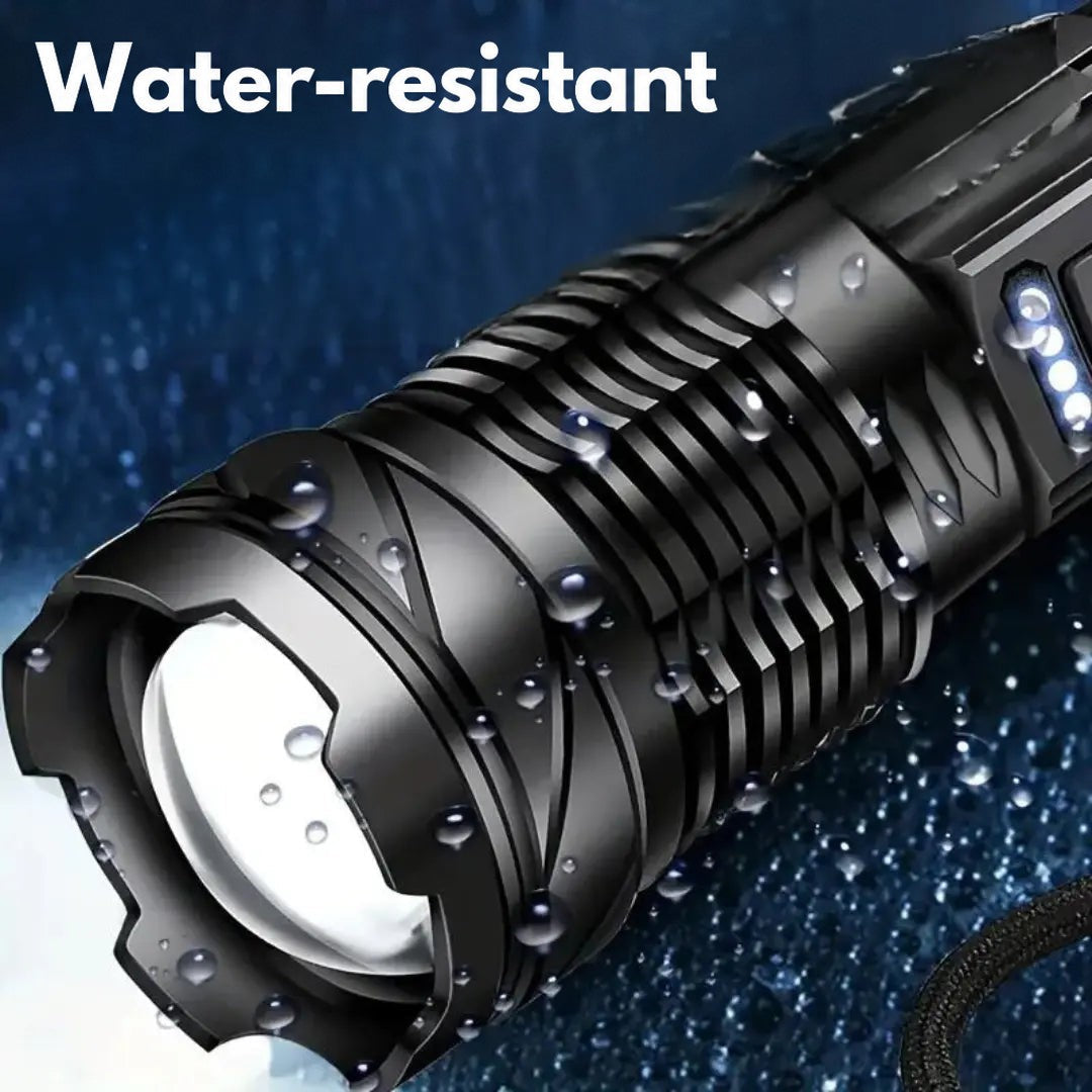 Close-up of the torch's lens end covered in water droplets, showing it is splash resistant 3