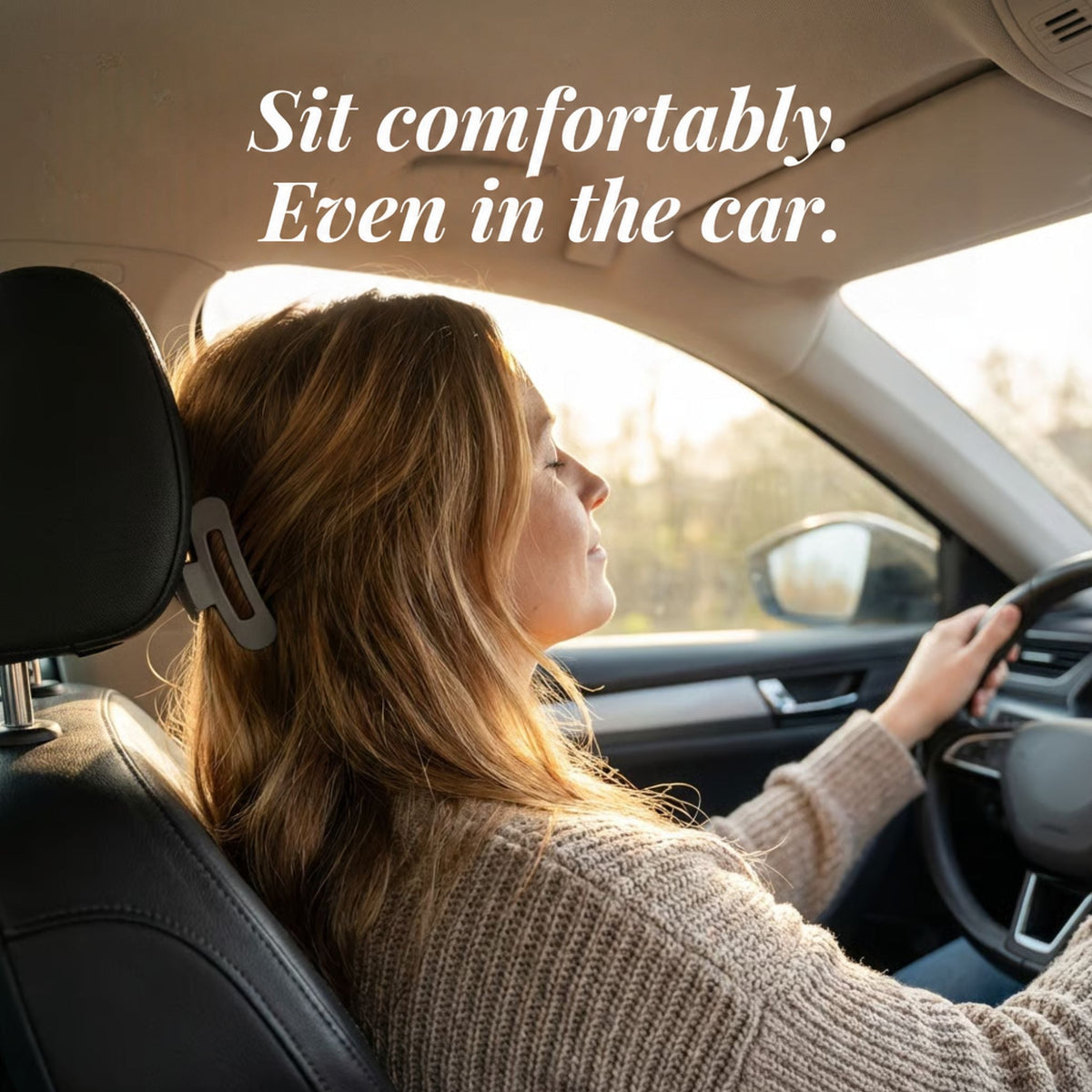 Woman driving with her hair pinned up in a grey slim flat clip against the headrest 2