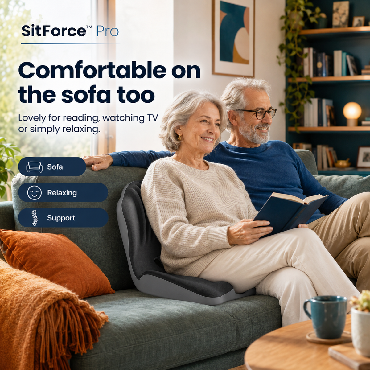 Older couple relaxing on a green sofa, the woman reading with the cushion supporting her back 2