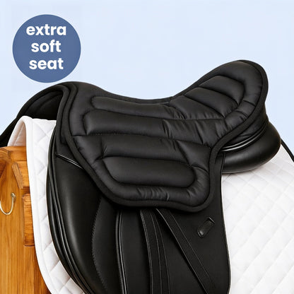 Black quilted seat cushion fitted over a black dressage saddle on a white quilted saddle pad 1