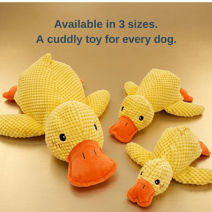 Three yellow plush ducks of different sizes arranged on a golden surface to show the size range 4