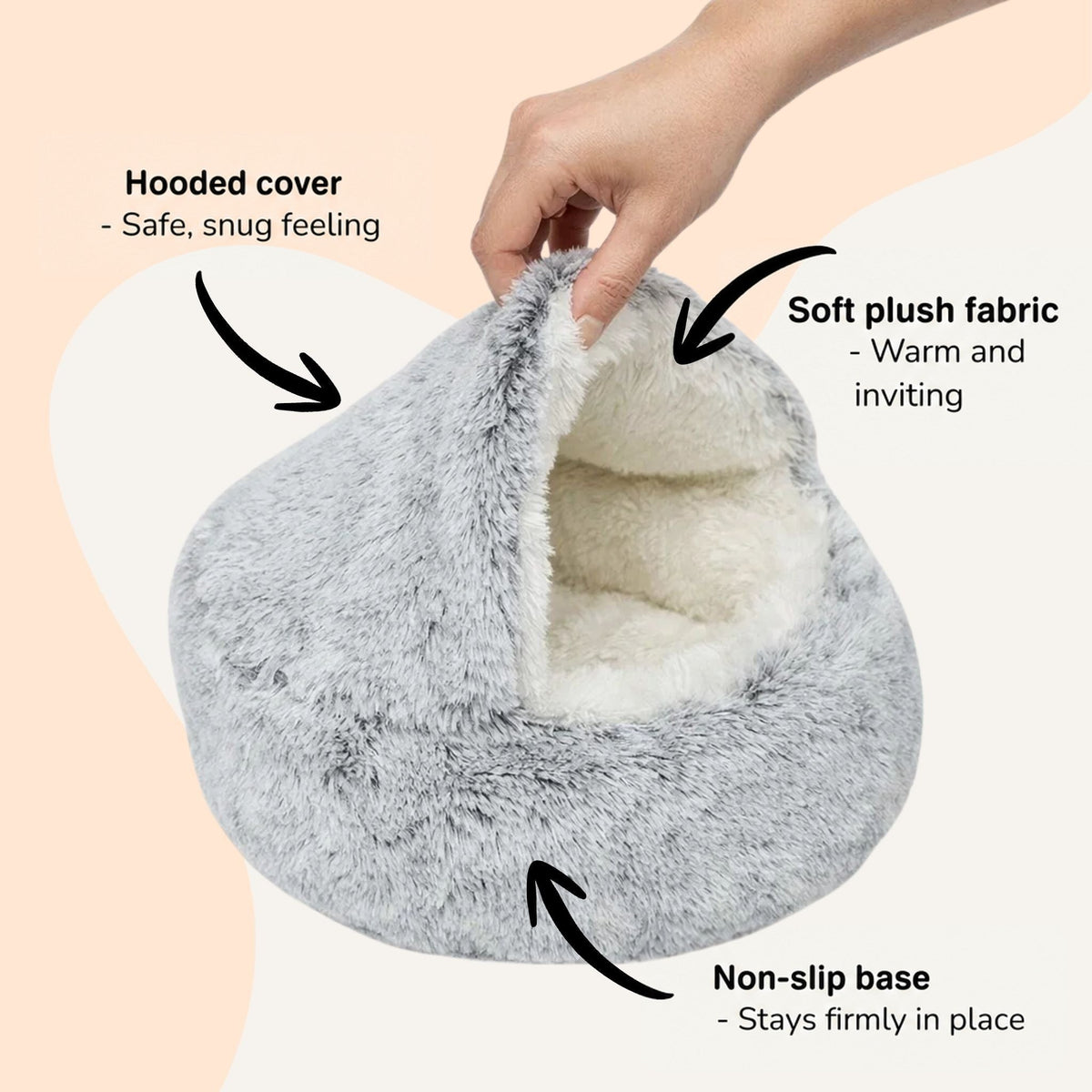 Hand lifting the hood of the grey bed to reveal the soft cream interior, with arrows pointing to its features. 6