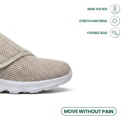 Close-up of the broad toe box of the beige mesh shoe, with icons for stretch material and flexible sole. 32