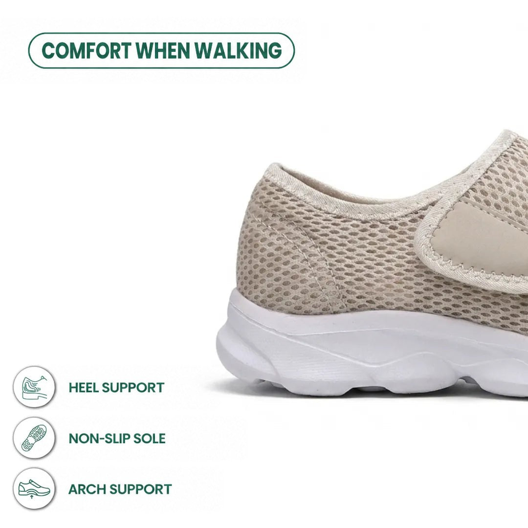 Close-up of the heel of the beige mesh shoe with hook-and-loop strap and white sole, with feature icons. 31