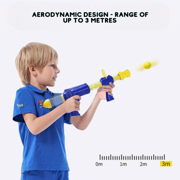 A blond boy in a blue polo shirt fires a blaster, with a distance scale showing three metres 9