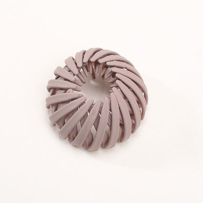 Single matte dusty mauve spiral clip, shown open and ring-shaped against a plain white background. 5