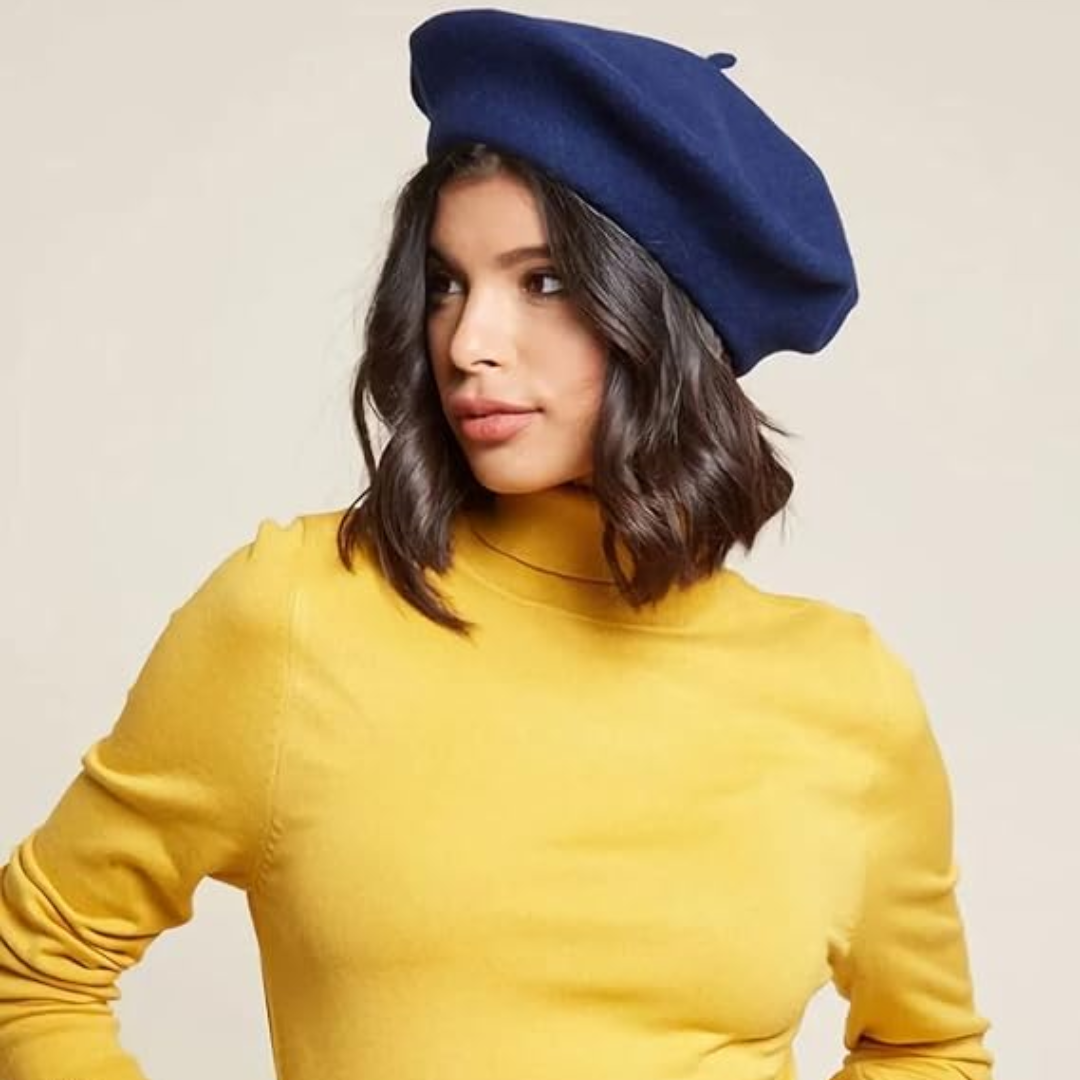 Woman in a navy beret and a mustard roll-neck jumper, glancing to the side 17
