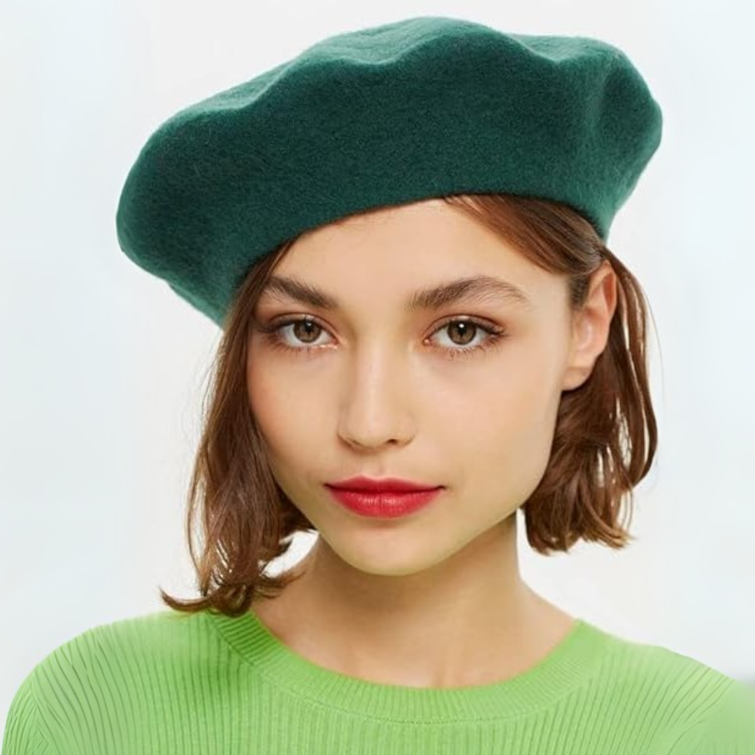 Woman with a short bob wearing a dark green beret and a bright green ribbed jumper 15