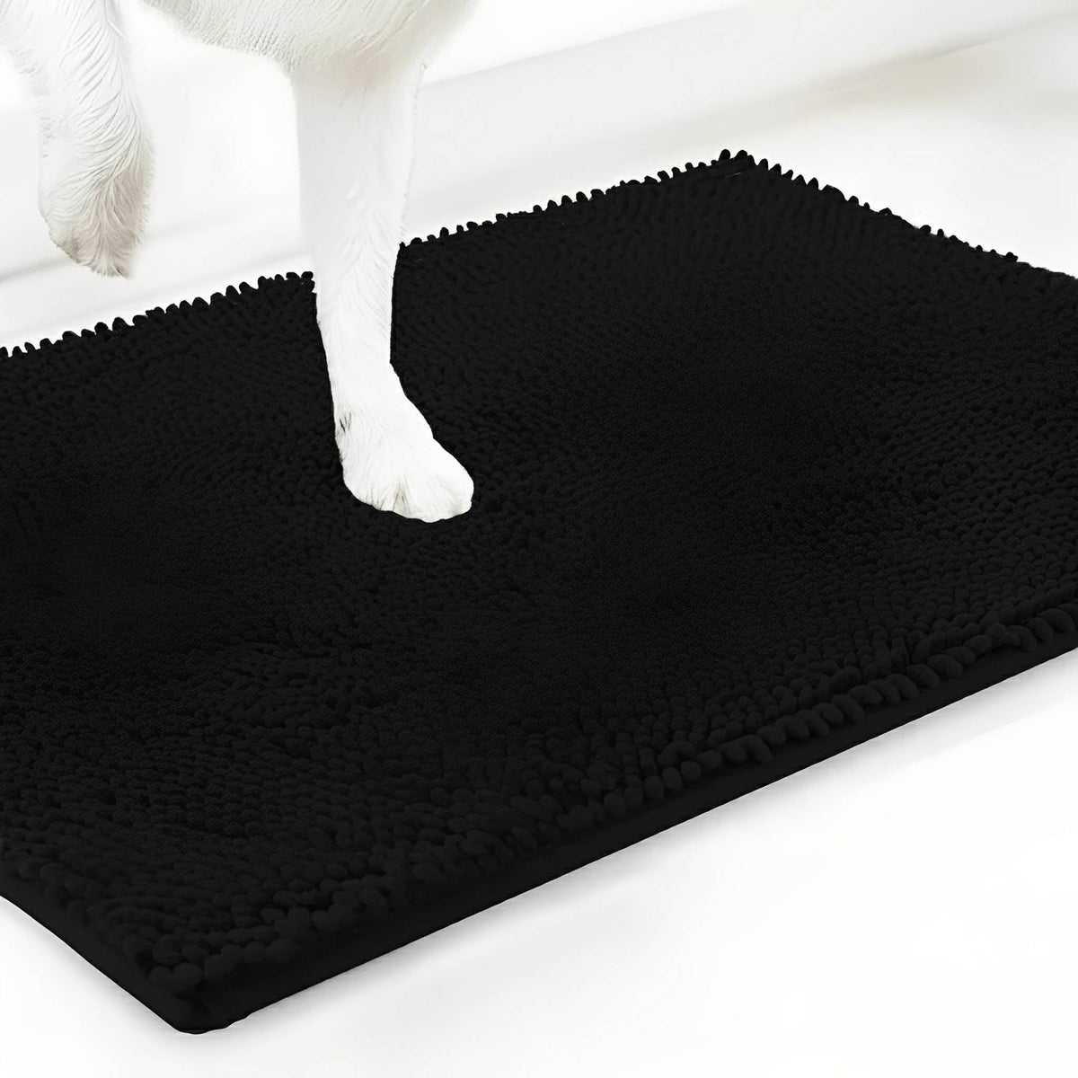 Black chenille mat shown at an angle with a white dog's paw stepping onto the pile, on a white background. 19