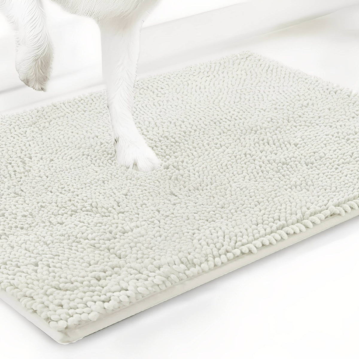 Off-white cream chenille mat shown at an angle with a white dog's paw resting on the pile, on a white background. 20