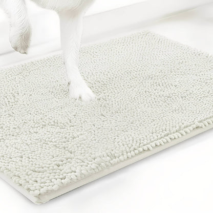 Off-white cream chenille mat shown at an angle with a white dog's paw resting on the pile, on a white background. 20