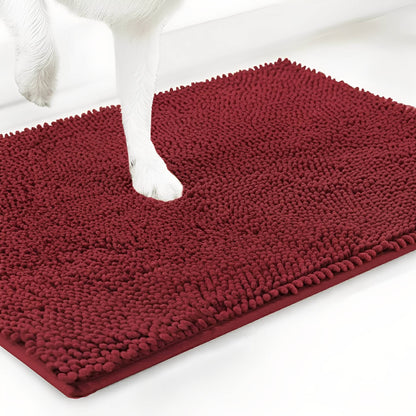 Deep red chenille mat shown at an angle with a white dog's paw stepping onto the pile, on a white background. 14