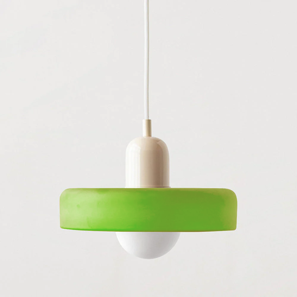 Pendant lamp with a lime green shade, cream cap and white cable on a plain background 56