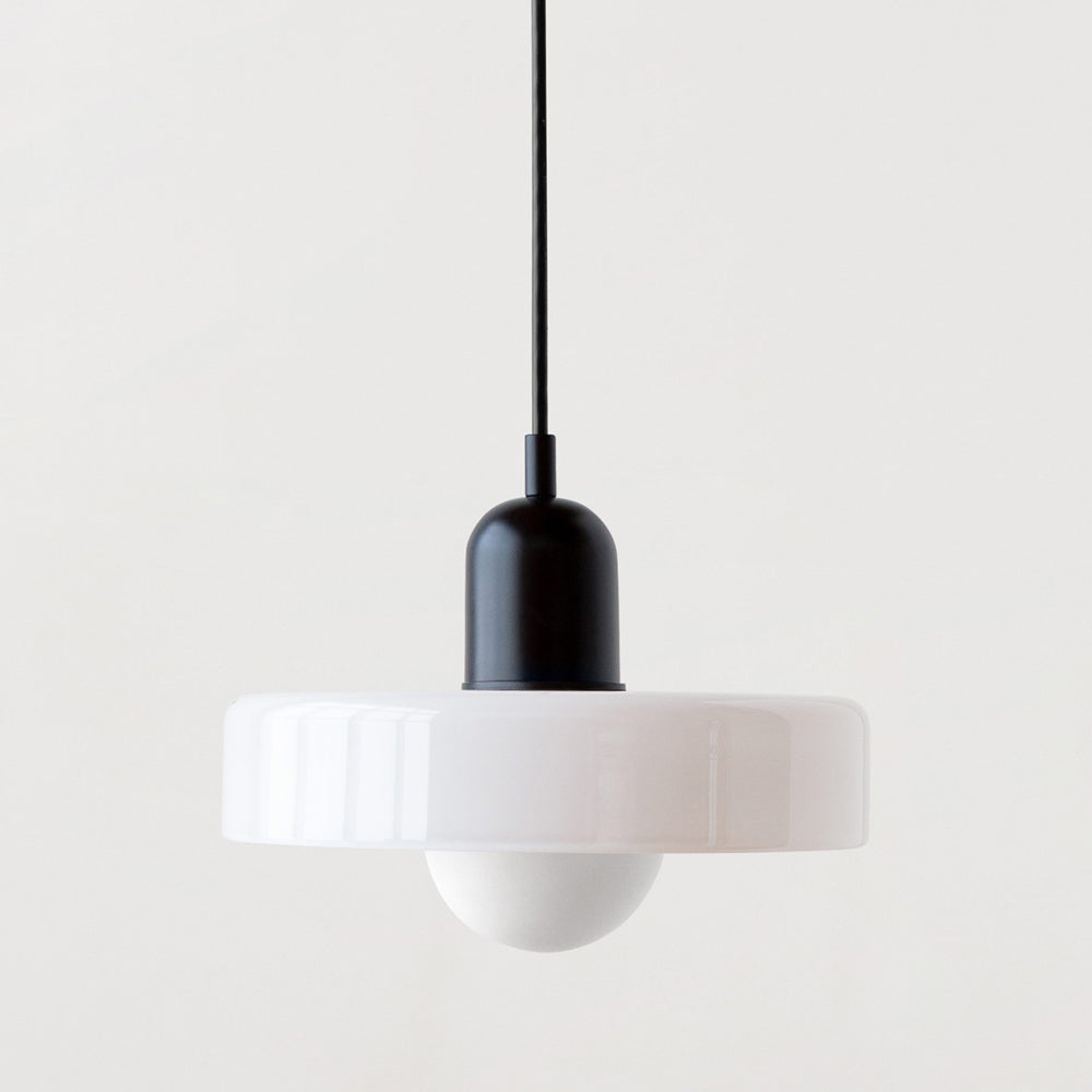 Pendant light with a glossy white glass shade, matt black cap and black cable, with a round opal bulb below 42