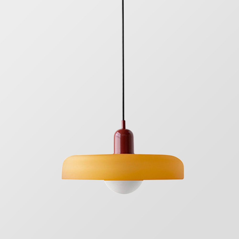 Amber glass pendant with a deep red cap and black cord on a grey backdrop 21