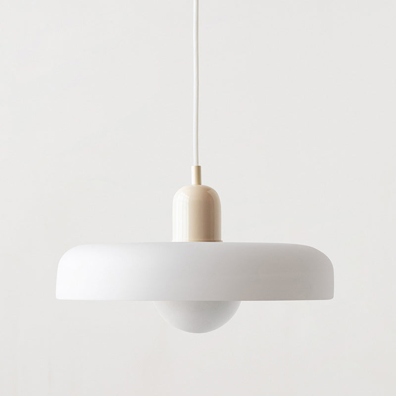White pendant lamp with a cream cap and white cord, seen from slightly below 48