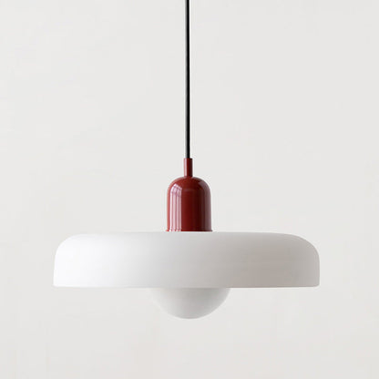 Wide white shade with a red cap and black cord, hanging against a pale wall 38