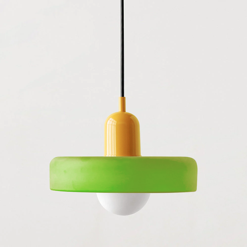 Pendant lamp with a lime green shade, yellow cap and black cable on a plain background 57