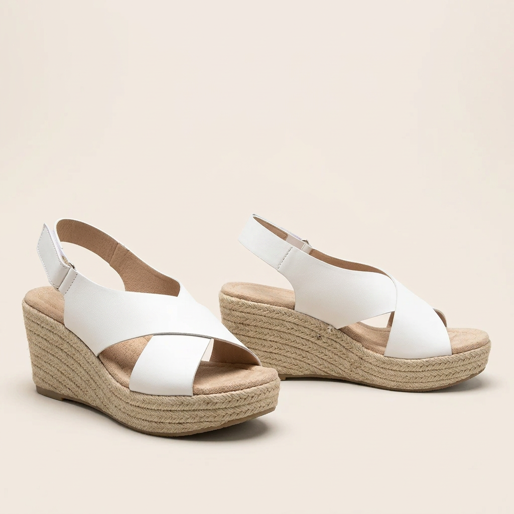 Pair of white crossover wedges on a cream background, showing the braided rope wedge and padded insole 15