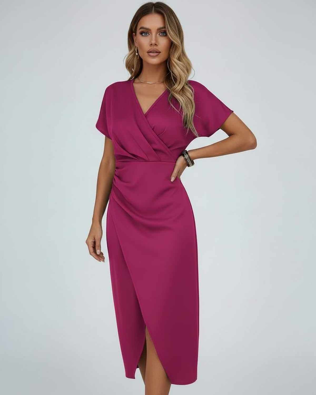 Model in the magenta-pink version with one hand on her hip, front view 1