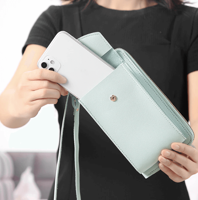 Compact PU leather shoulder bag with an adjustable strap.