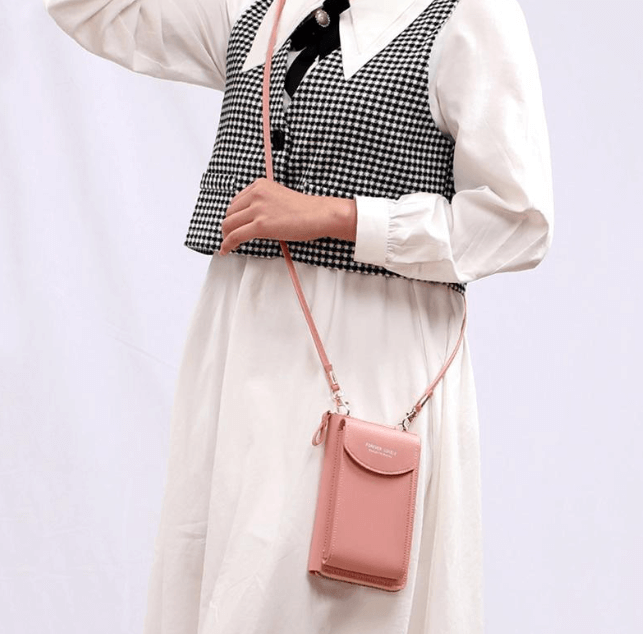 Compact PU leather shoulder bag with an adjustable strap.