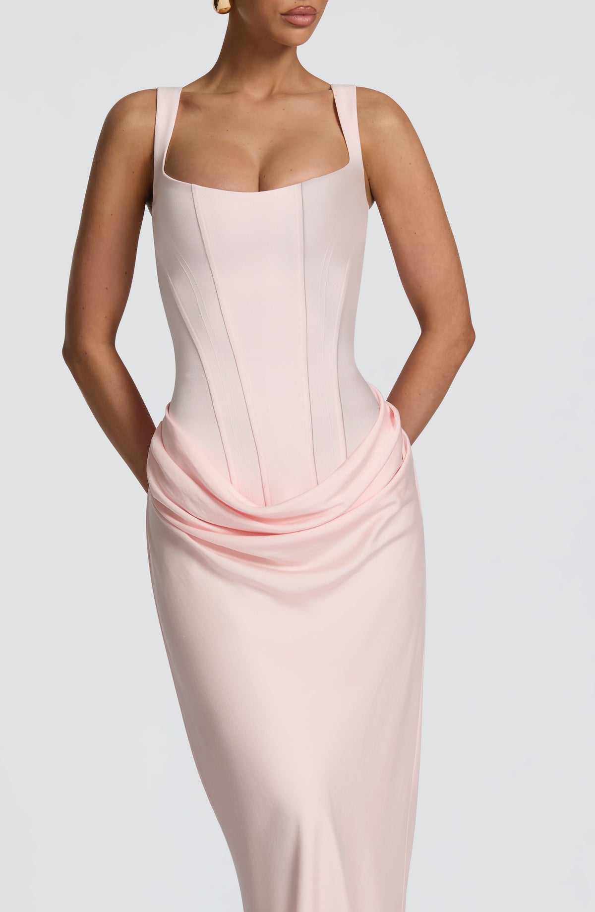 Close-up of the pale pink corset bodice and soft draped detail at the hip 16