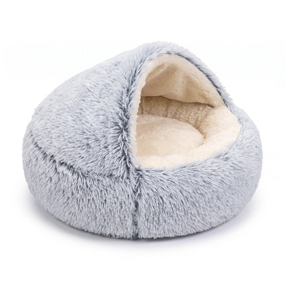Light grey shaggy hooded bed on a white background, hood partly open to show the cream interior. 13