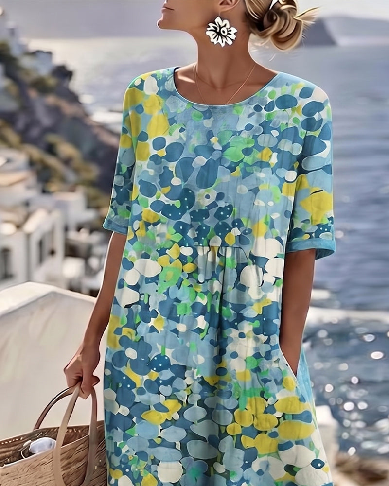 Upper-body detail of the blue floral dress showing round neckline, gathered waist and short sleeves 12