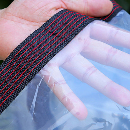 Close-up of a hand holding the black woven tarp edge with red stitching, with fingers visible through the transparent sheet. 4