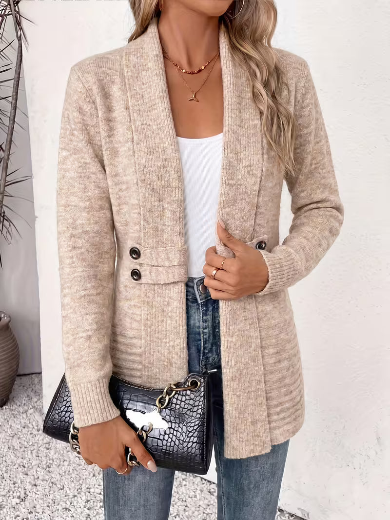 Beige cardigan worn open with one hand holding the edge, a black crocodile-effect handbag in front 3