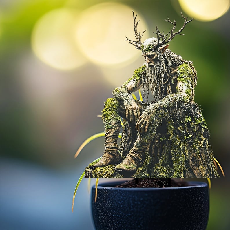 Antlered woodland spirit on a moss-covered stump, staked in the soil of a dark blue plant pot against a blurred background. 8