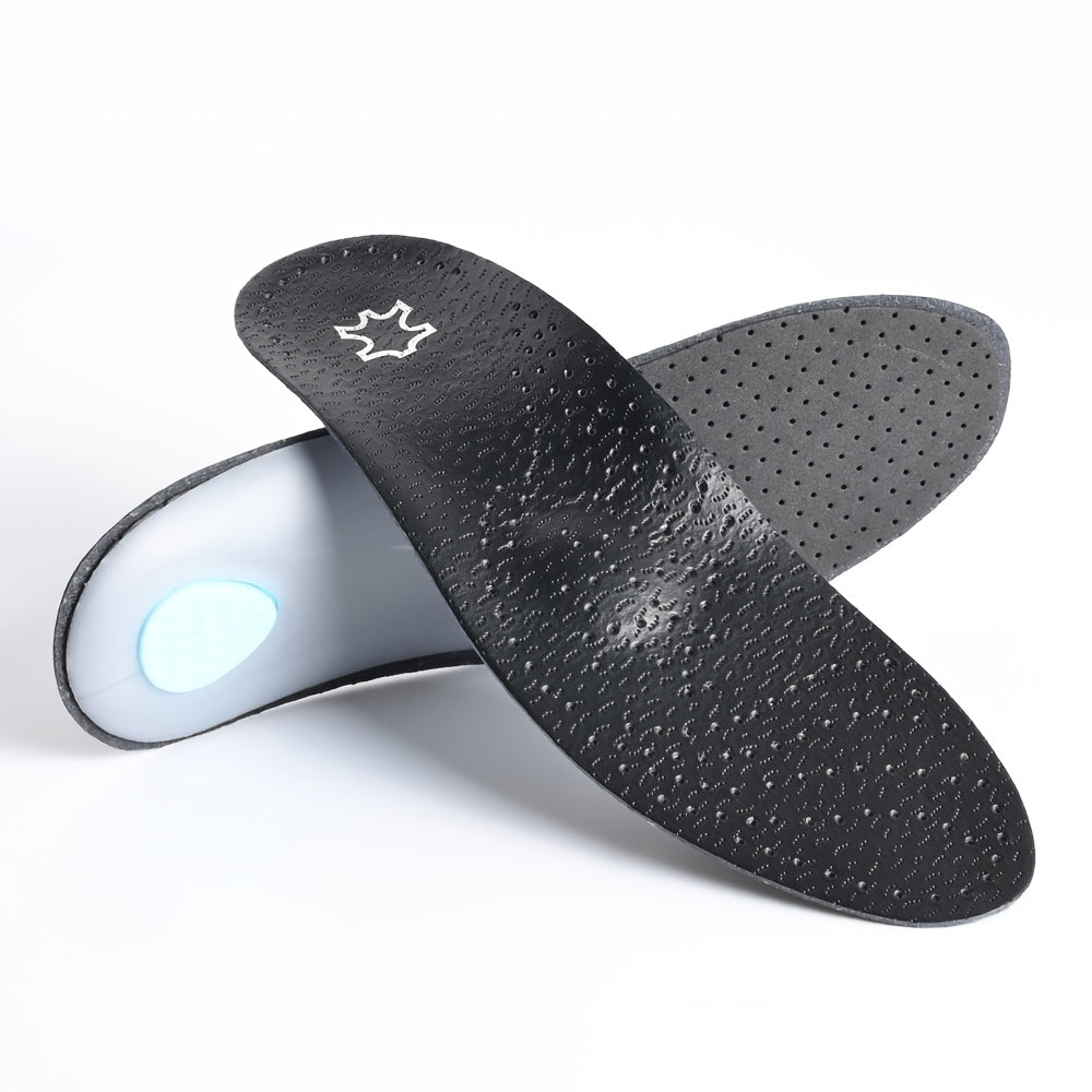 Pair of black perforated insoles crossed over each other, showing the textured top surface and the pale underside with a blue heel pad. 1
