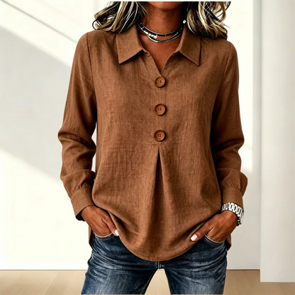 Brown version of the shirt with three wooden buttons, worn by a model with hands in pockets 3