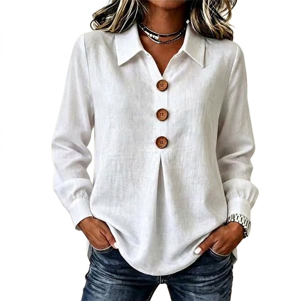White textured shirt with three wooden buttons and pleat, worn with jeans and hands in pockets 1