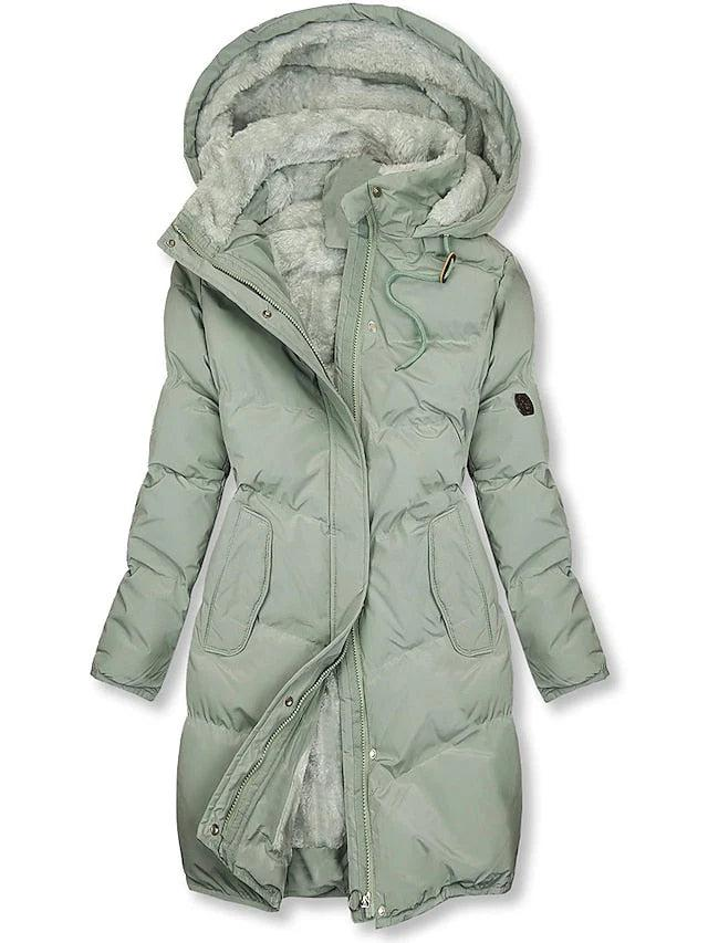 Pale sage green version of the quilted hooded coat, zip partly undone to reveal grey-green fleece lining and the drawstring collar. 2