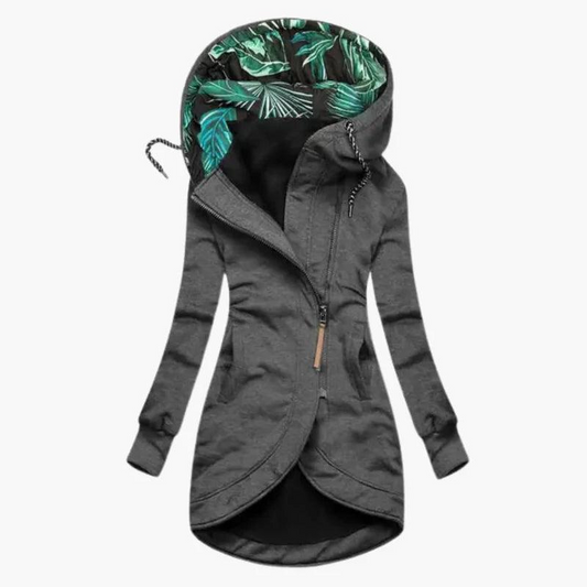 Dark grey version of the long hooded jacket, zip open slightly at the neck to show the leaf-print hood lining and black inner. 2