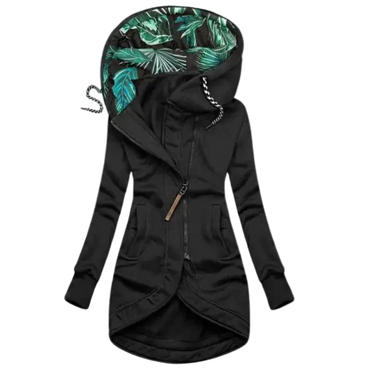 Black long hooded jacket with diagonal zip, curved hem, side pockets and a green leaf-print hood lining, shown flat. 1