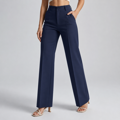 Navy blue high-waisted wide-leg trousers on a model with one hand in the pocket 11