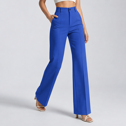 Bright cobalt blue high-waisted trousers on a model, walking pose, hand in the pocket 15
