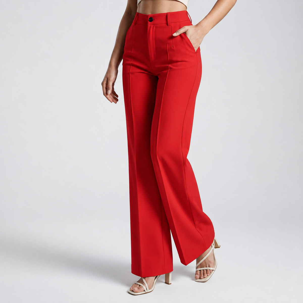Red high-waisted wide-leg trousers shown from a slight angle, with a hand in the pocket 16