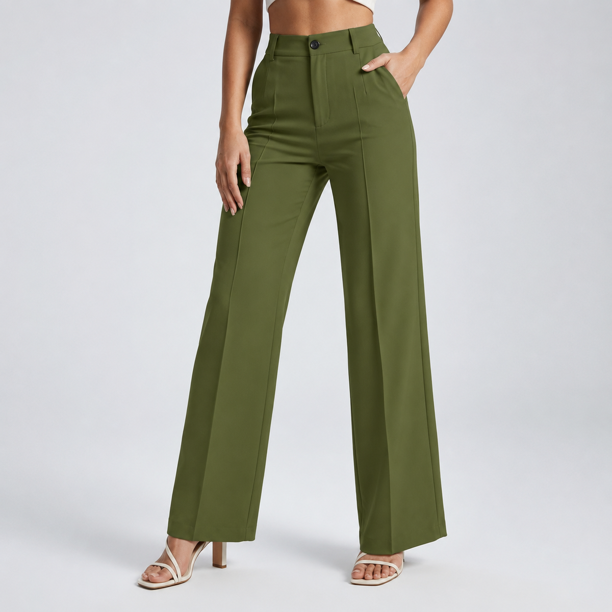 Olive green high-waisted wide-leg trousers on a model with one hand in the pocket 20