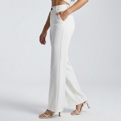 Side view of white trousers on a model, hand in the side pocket, showing the straight leg 4