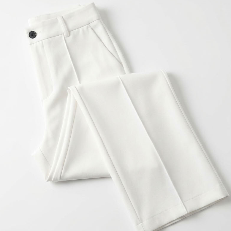 White trousers folded flat, showing the dark button, belt loops, side pocket and front crease 7