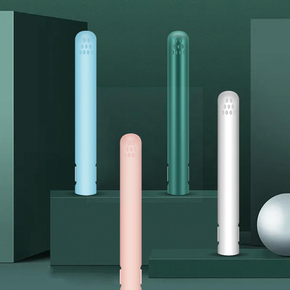 Four closed straighteners in blue, dark green, white and pink standing on green display blocks, showing vented tips. 4