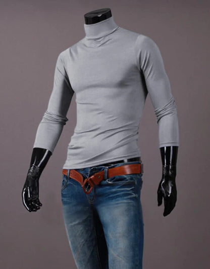 Light grey high neck top on a headless mannequin, styled with blue jeans and a tan belt 12