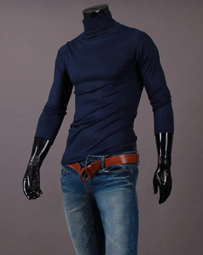 Navy high neck top on a headless mannequin, styled with blue jeans and a tan belt 13