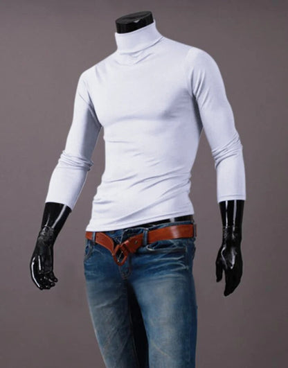 White high neck top on a headless mannequin, styled with blue jeans and a tan belt 11