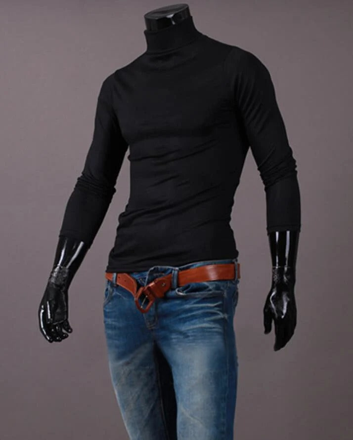 Black high neck top on a headless mannequin, worn with blue jeans and a tan belt 10